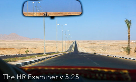 Photo of empty road from car with rear view mirror visible in feature article called Looking Back at Recruiting in HRExaminer.com v5.25 for June 27, 2014